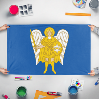 A mockup of the custom flag 'Archangel Michael Blue flag' held up on a table during print checking