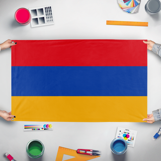 A mockup of the custom flag 'test flag' held up on a table during print checking