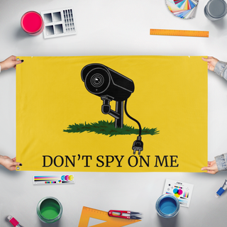 A mockup of the custom flag 'Don't Spy On Me flag' held up on a table during print checking
