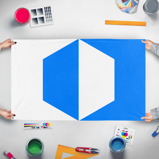 A mockup of the custom flag 'Cubeland flag' held up on a table during print checking
