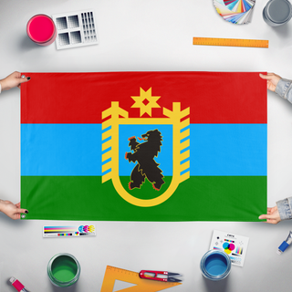 A mockup of the custom flag 'T flag' held up on a table during print checking