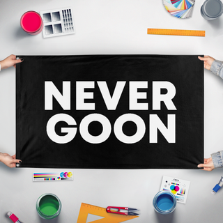 A mockup of the custom flag 'Never Goon flag' held up on a table during print checking