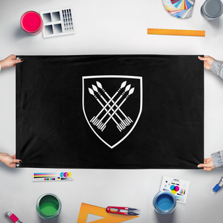 A mockup of the custom flag '32nd Batt flag' held up on a table during print checking