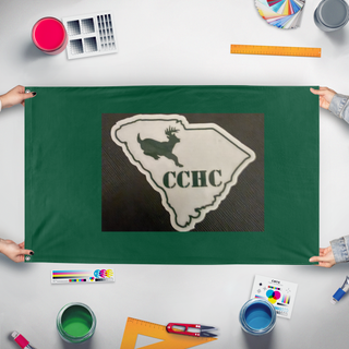 A mockup of the custom flag 'CCHC flag' held up on a table during print checking