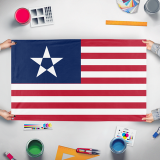 A mockup of the custom flag 'The Tyranny of King Washington flag' held up on a table during print checking