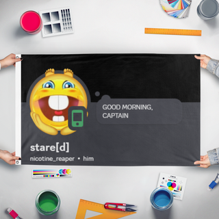 A mockup of the custom flag 'Stare flag' held up on a table during print checking