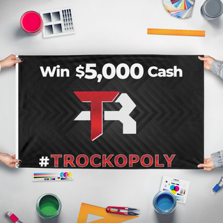 A mockup of the custom flag 'TRock flag' held up on a table during print checking