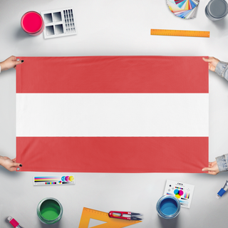 A mockup of the custom flag 'a flag' held up on a table during print checking