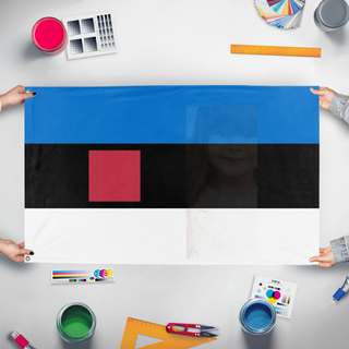A mockup of the custom flag 'test flag' held up on a table during print checking