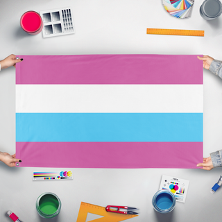 A mockup of the custom flag 'Femboy Clique flag' held up on a table during print checking