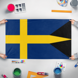 A mockup of the custom flag 'Historical Swedish flag' held up on a table during print checking