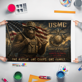 A mockup of the custom flag 'USMC Bigfoot flag' held up on a table during print checking