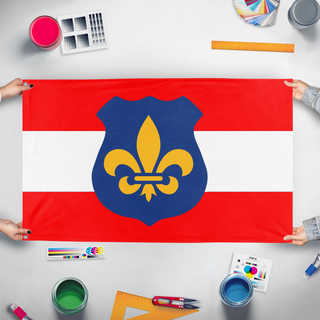 A mockup of the custom flag '100 flag' held up on a table during print checking