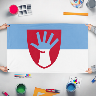 A mockup of the custom flag '99 flag' held up on a table during print checking