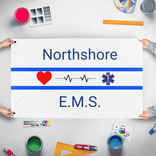 A mockup of the custom flag 'Northshore E.M.S. flag' held up on a table during print checking