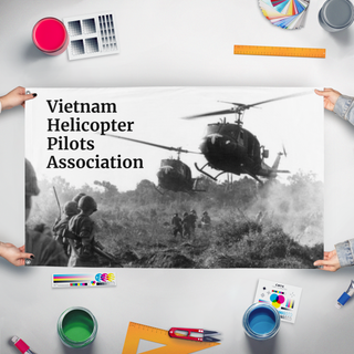 A mockup of the custom flag 'Vietnam Helicopter Pilots Association flag' held up on a table during print checking