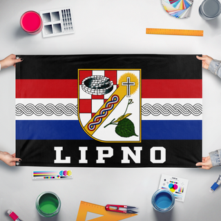 A mockup of the custom flag 'LIPNO! flag' held up on a table during print checking