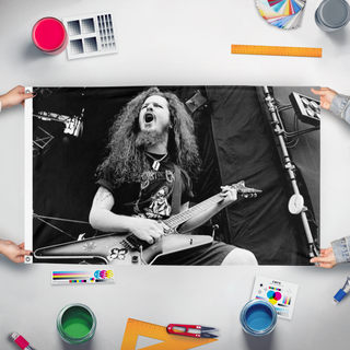A mockup of the custom flag 'Dimebag Darrell flag' held up on a table during print checking