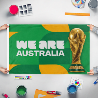 A mockup of the custom flag 'we are australia flag' held up on a table during print checking