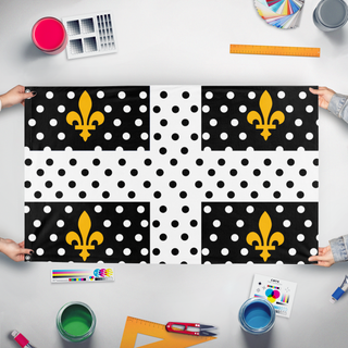 A mockup of the custom flag 'Angine Flag' held up on a table during print checking