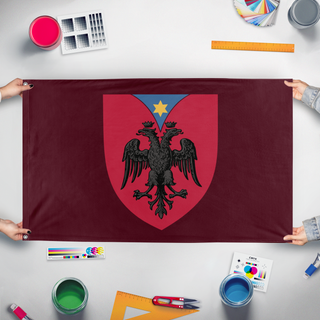 A mockup of the custom flag 'Personal Custom Coat of Arms flag' held up on a table during print checking