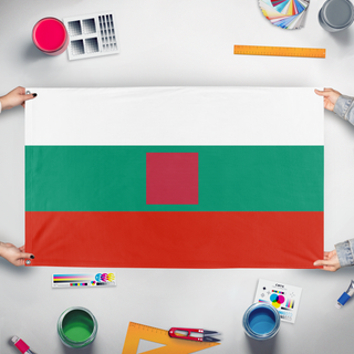 A mockup of the custom flag 'T flag' held up on a table during print checking