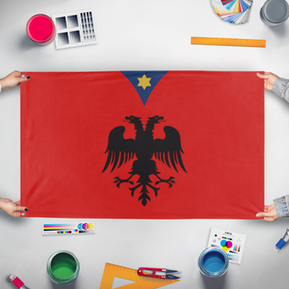 A mockup of the custom flag 'T flag' held up on a table during print checking
