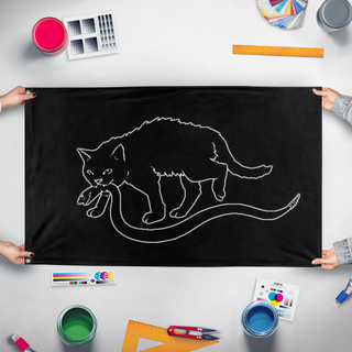 A mockup of the custom flag 'Catsden flag' held up on a table during print checking