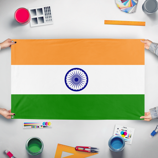 A mockup of the custom flag 'T flag' held up on a table during print checking