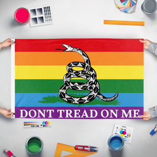 A mockup of the custom flag 'gadsden flag' held up on a table during print checking