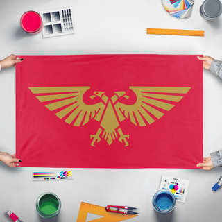 A mockup of the custom flag 'Imperium of Man flag' held up on a table during print checking