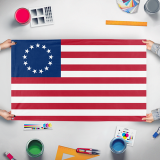 A mockup of the custom flag 'hgh flag' held up on a table during print checking