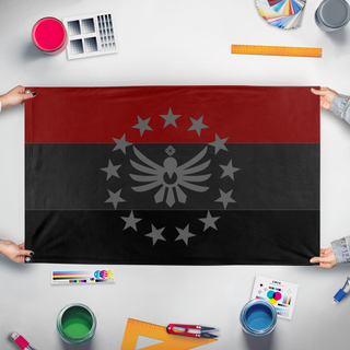 A mockup of the custom flag 'Sitherion Union flag' held up on a table during print checking