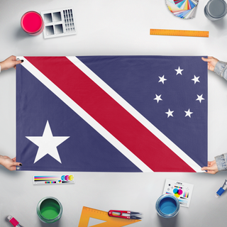 A mockup of the custom flag 'Distinct in Origin, United in Liberty flag' held up on a table during print checking