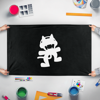 A mockup of the custom flag 'Monstercat flag' held up on a table during print checking