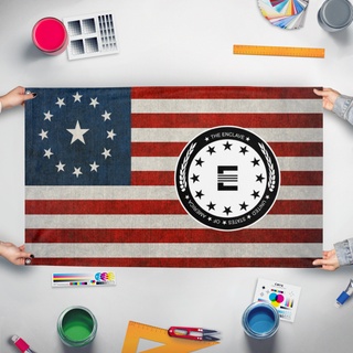 A mockup of the custom flag 'US-Enclave Seal Flag' held up on a table during print checking