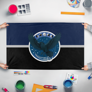 A mockup of the custom flag 'Raven's Hollow flag' held up on a table during print checking