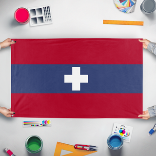A mockup of the custom flag 'Alpine Union flag' held up on a table during print checking