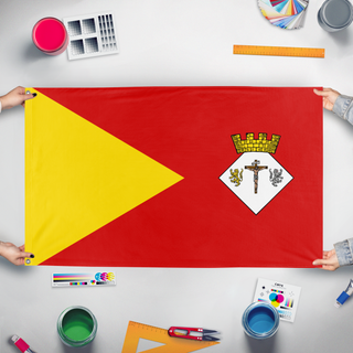 A mockup of the custom flag 'c flag' held up on a table during print checking