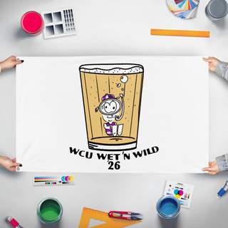 A mockup of the custom flag 'wet n wild flag' held up on a table during print checking