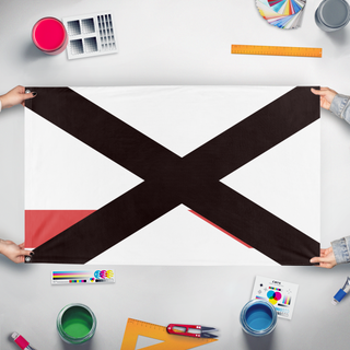 A mockup of the custom flag 'Baja flag' held up on a table during print checking
