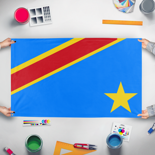 A mockup of the custom flag 'Congoa flag' held up on a table during print checking