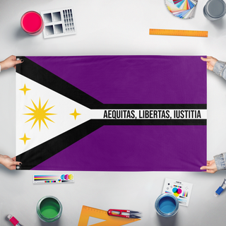 A mockup of the custom flag 'Peralla flag' held up on a table during print checking