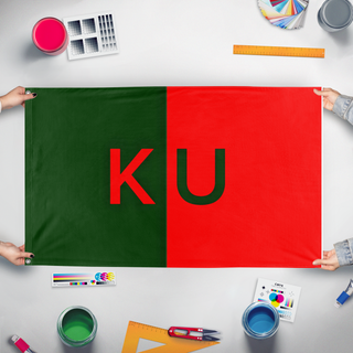 A mockup of the custom flag 'kaldoria united flag' held up on a table during print checking