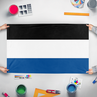A mockup of the custom flag 'Westhelm flag' held up on a table during print checking