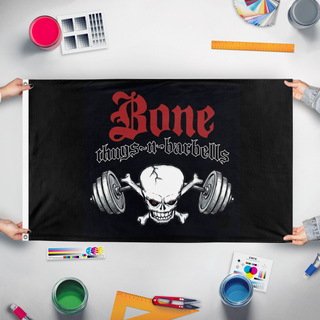 A mockup of the custom flag 'Bone thugs-n-barbells flag' held up on a table during print checking