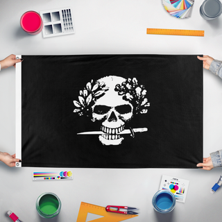 A mockup of the custom flag 'Arditi flag' held up on a table during print checking