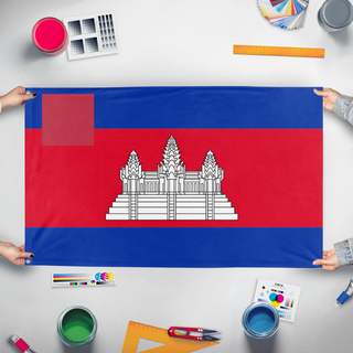 A mockup of the custom flag 'T flag' held up on a table during print checking