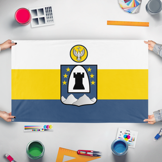 A mockup of the custom flag 'Columban flag' held up on a table during print checking