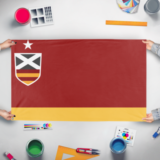 A mockup of the custom flag 'Tucana flag' held up on a table during print checking